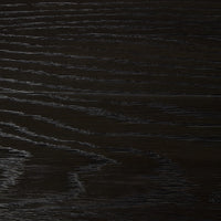 Worn black wood texture of the Darby Coffee Table surface detail.