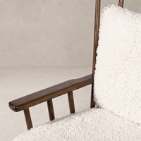 Whitley Chair in Andes Natural featuring soft, textured upholstery and sleek wooden armrest.