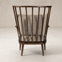 Whitley Chair in Manchester Flint featuring a unique curved wood frame and soft, textured upholstery.