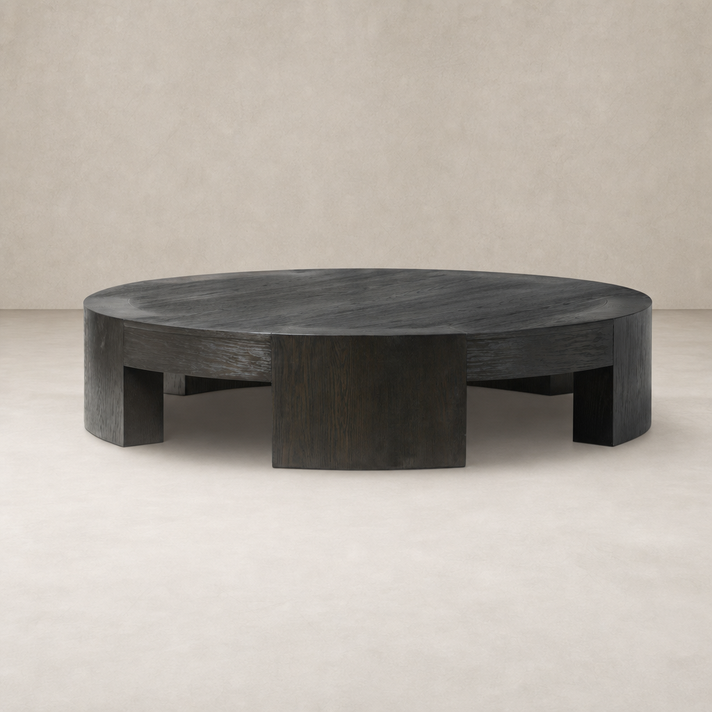Round Hastings Coffee Table in Charcoal Oak with a sleek, modern design.