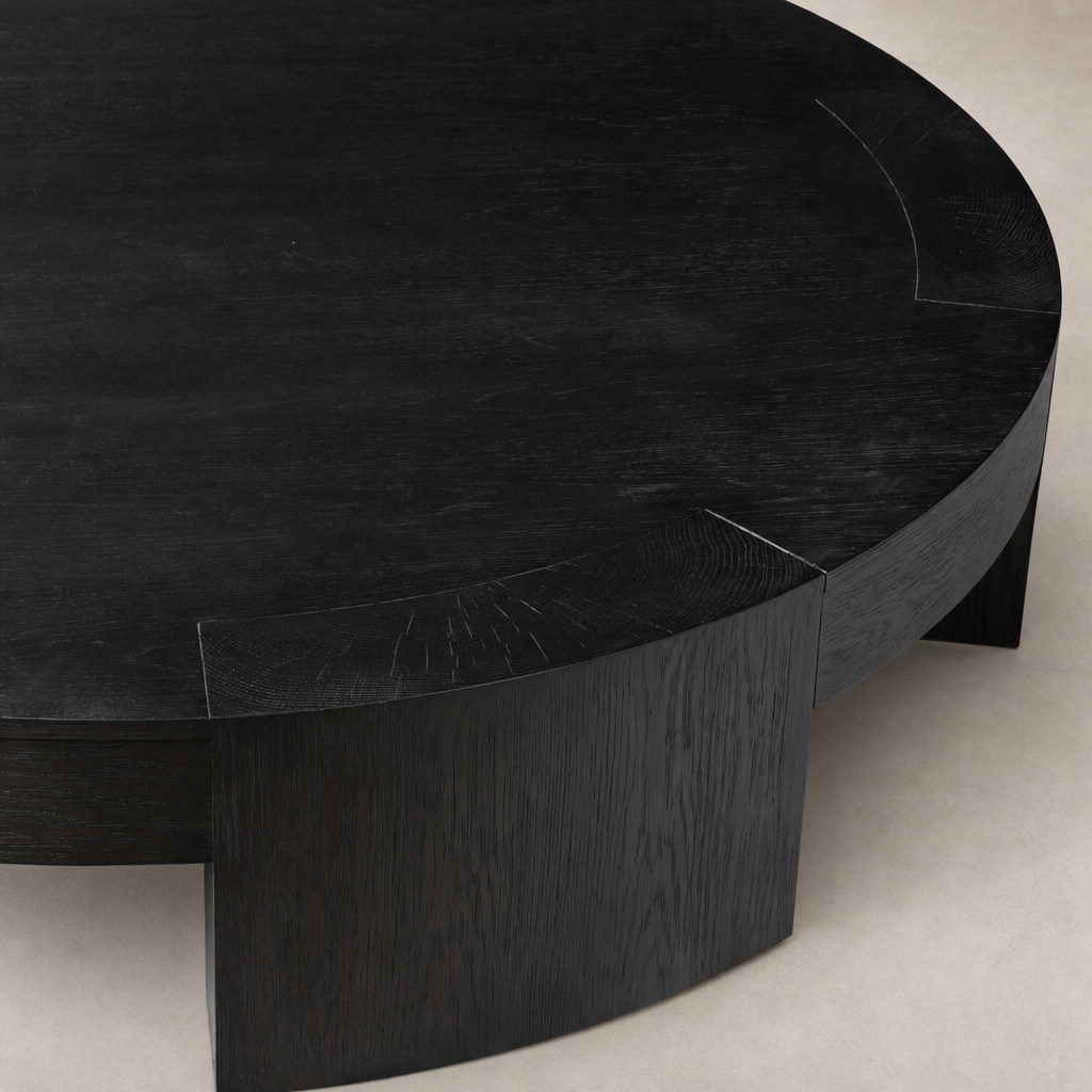 Round Hastings Coffee Table in Charcoal Oak featuring a modern design and smooth finish.