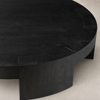 Round Hastings Coffee Table in Charcoal Oak featuring a modern design and smooth finish.