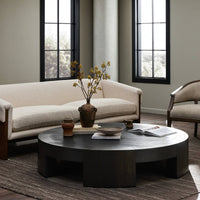 Stylish Hastings Coffee Table in Charcoal Oak, featuring a round design and textured finish.
