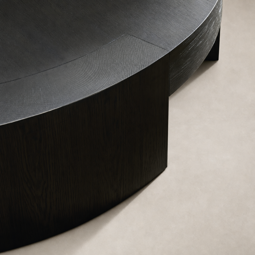 Hastings Coffee Table featuring a sleek charcoal oak finish with smooth, rounded edges.