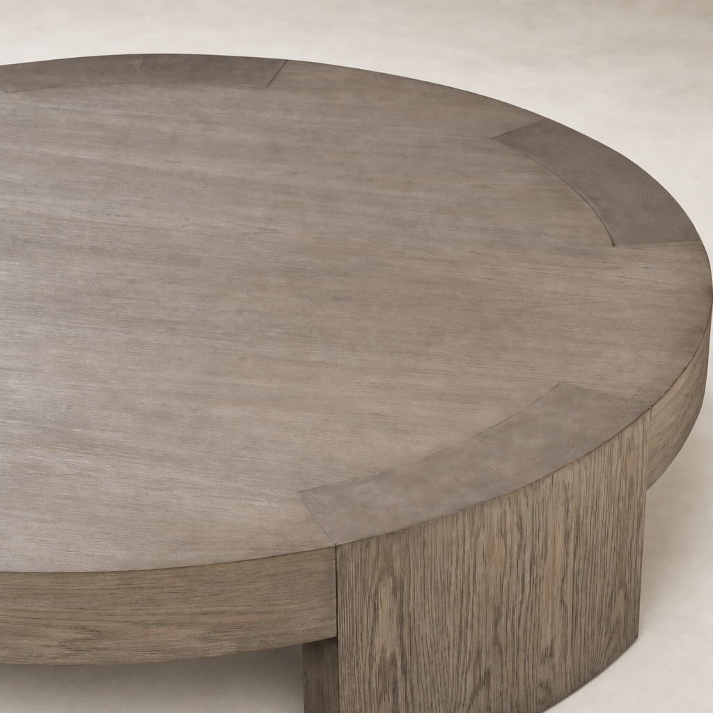 Round Hastings Coffee Table in warm natural flat oak with a smooth finish.