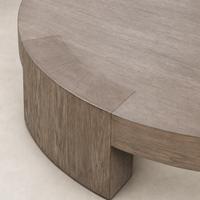 Hastings Coffee Table in warm natural flat oak with a smooth, curved design.