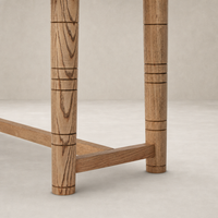 Close-up of Aspen Top Console Table legs in toasted ash, highlighting the unique grain and design.