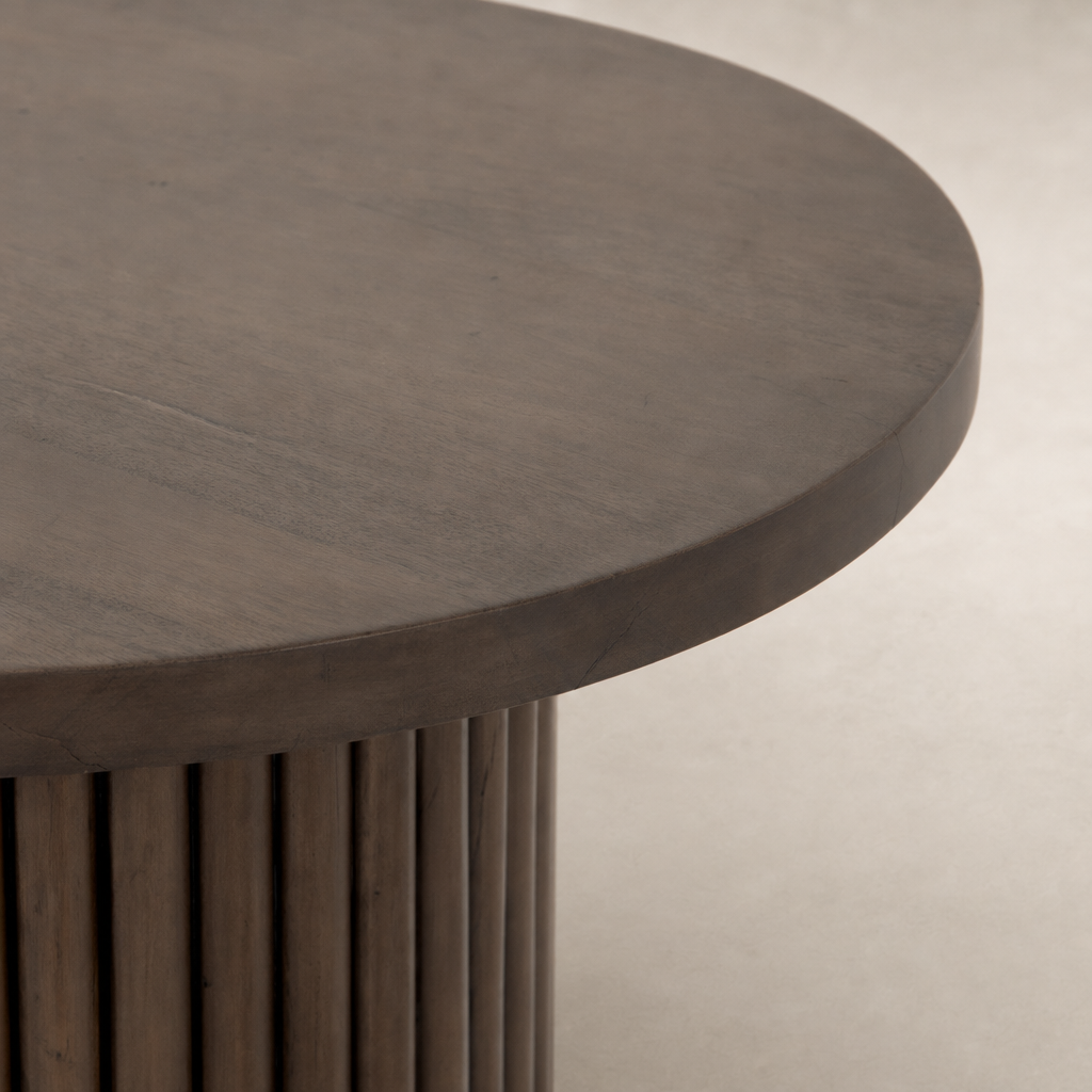 Round Ashford End Table featuring a smooth, dark wood finish and fluted design.