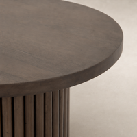 Round Ashford End Table featuring a smooth, dark wood finish and fluted design.