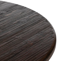 Close-up of the Ravello Round Dining Table showcasing its textured wooden surface and rich finish.