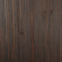 Close-up of the rich, textured surface of the Ravello Round Dining Table in dark wood finish.
