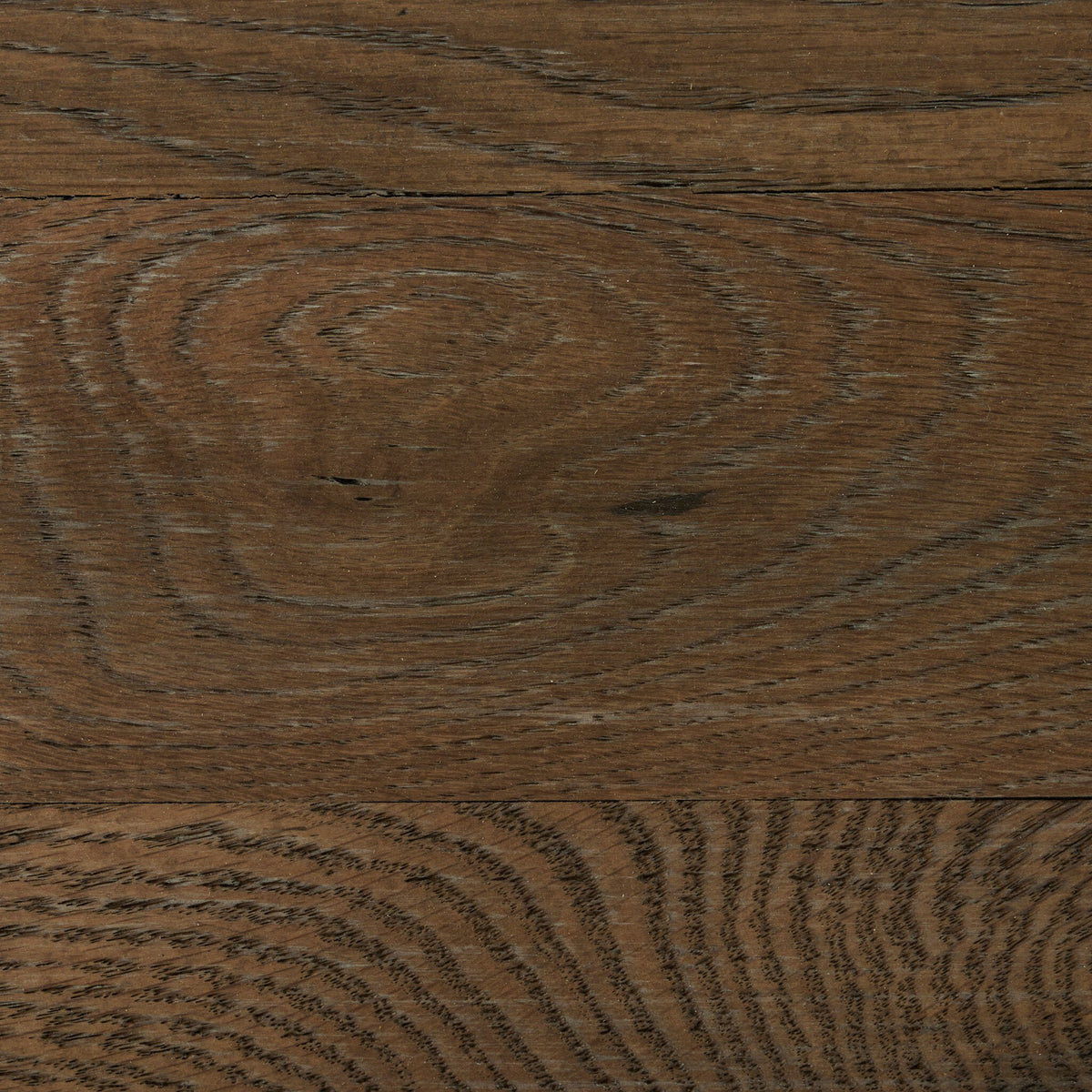 Close-up of the Fairview Coffee Table's weathered oak finish showcasing rich wood grain texture.