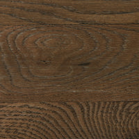 Close-up of the Fairview Coffee Table's weathered oak finish showcasing rich wood grain texture.