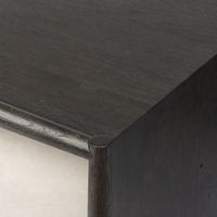 Close-up of Fairview Coffee Table in Smoked Black Resawn Oak with rounded edges.