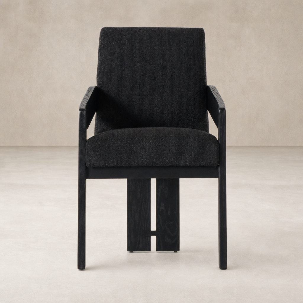 Gibson Black dining armchair with a sleek design and comfortable upholstery.