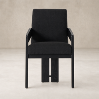 Gibson Black dining armchair with a sleek design and comfortable upholstery.