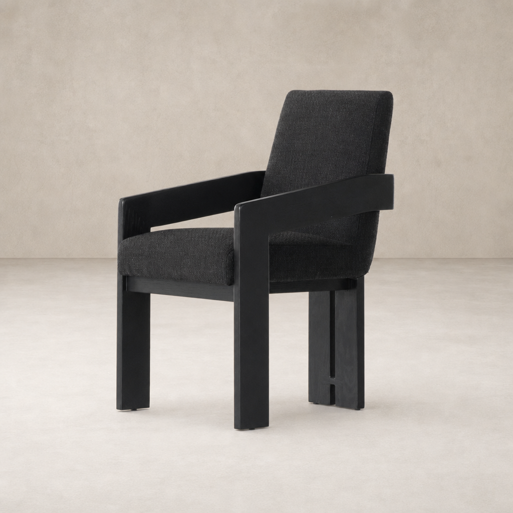 Gibson Black dining armchair with a modern, sleek design and comfortable fabric upholstery.