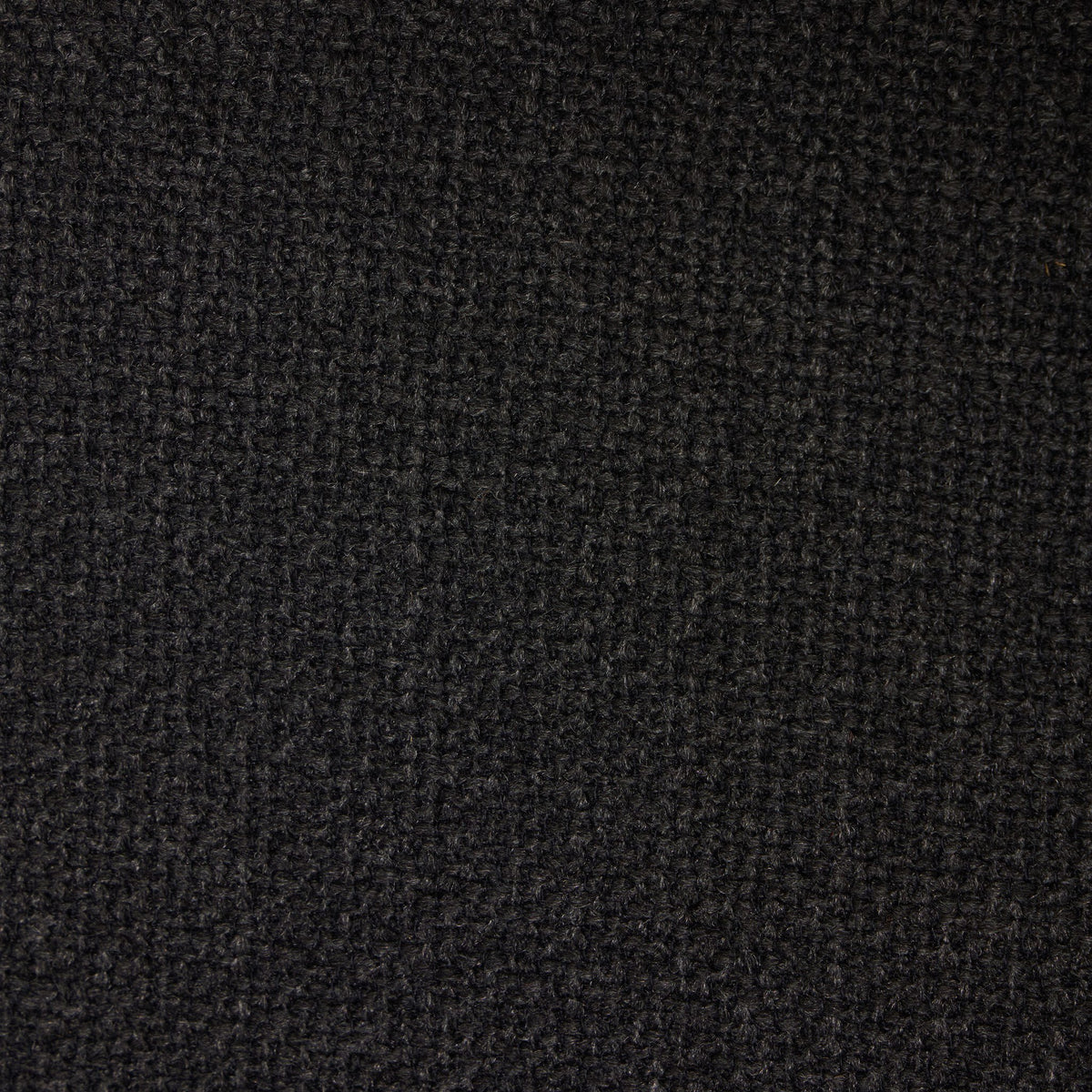 Gibson Black dining armchair showcasing a textured, woven fabric finish.
