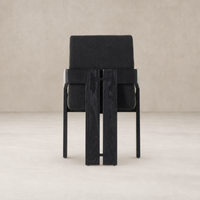 Black dining armchair with a cushioned seat and stylish wood frame.