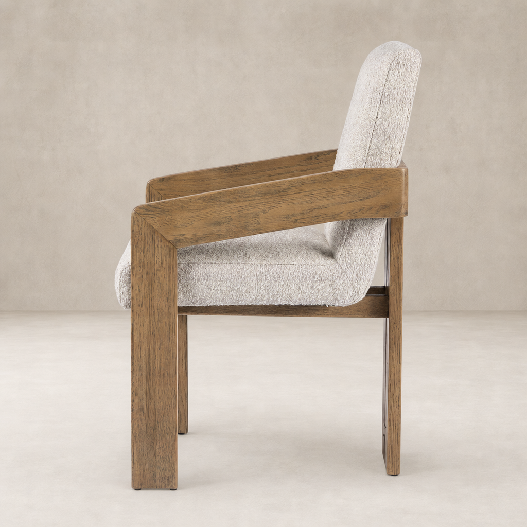 Side view of a Somerton Ash dining armchair with a textured fabric seat.