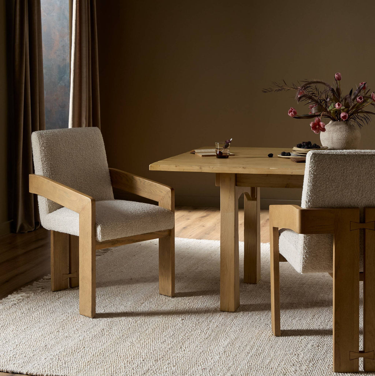 Somerton Ash dining armchair with soft, textured upholstery in a cozy dining setting.