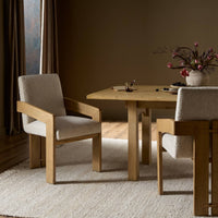 Somerton Ash dining armchair with soft, textured upholstery in a cozy dining setting.
