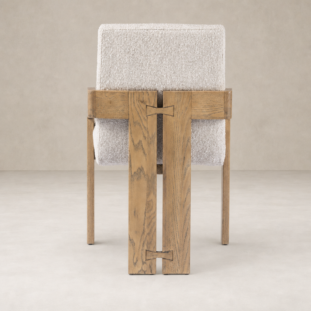 Somerton Ash dining armchair featuring a minimalist design and textured upholstery.