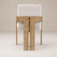 Somerton Ash dining armchair featuring a minimalist design and textured upholstery.