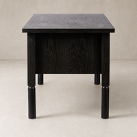 Charcoal Oak Uma Desk featuring a sleek, modern design and sturdy legs.