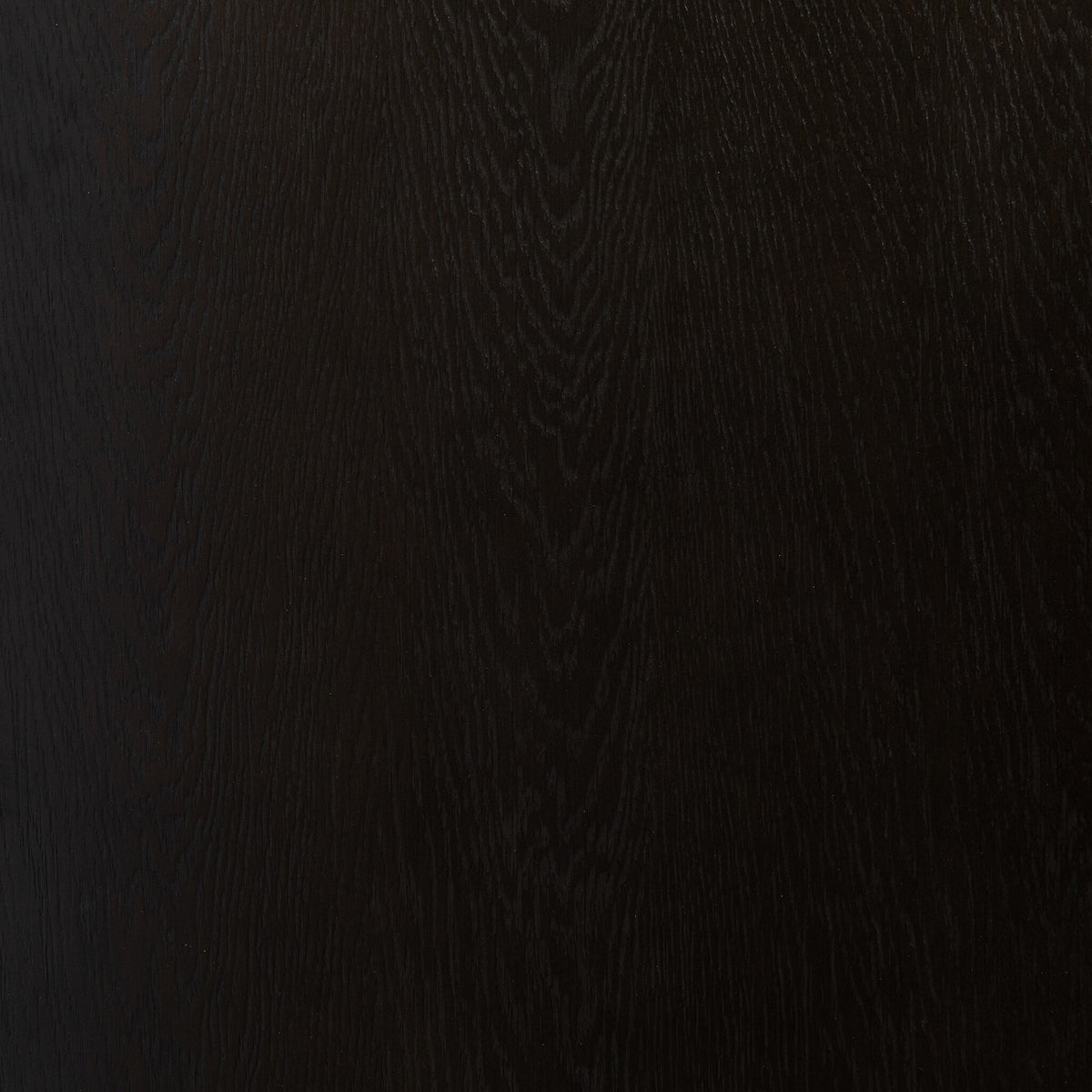 Charcoal Oak surface of Uma Desk showcasing rich wood grain texture.