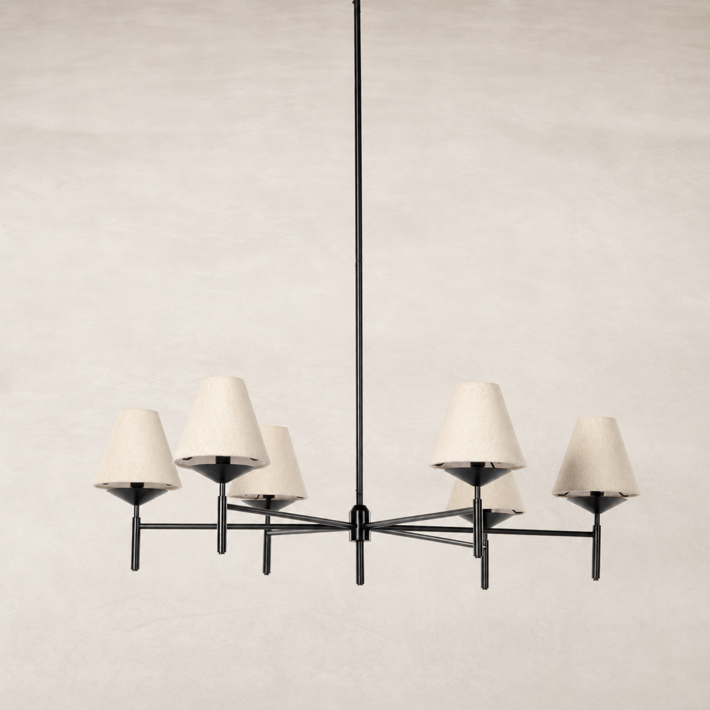 Jet black chandelier with six cream lampshades and minimalist design.