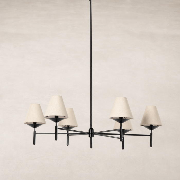 Jet black chandelier with six cream lampshades and minimalist design.