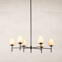 Jet black chandelier featuring six cream shades and a modern design.