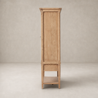 Helsinki Wide Cabinet in aged light pine with a tall, narrow design and open shelf.
