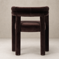 Tivoli Dining Chair in Surrey Cocoa with a sleek, rounded design and soft texture.