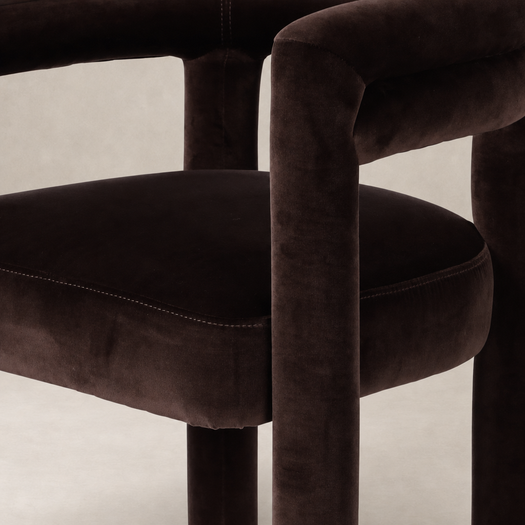 Tivoli Dining Chair in Surrey Cocoa featuring soft velvet upholstery and rounded edges.