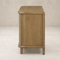 Laurent Sideboard in amber oak featuring rounded edges and a smooth finish.