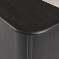 Close-up of the Laurent Sideboard in smoked black solid, highlighting its smooth, rounded edges.