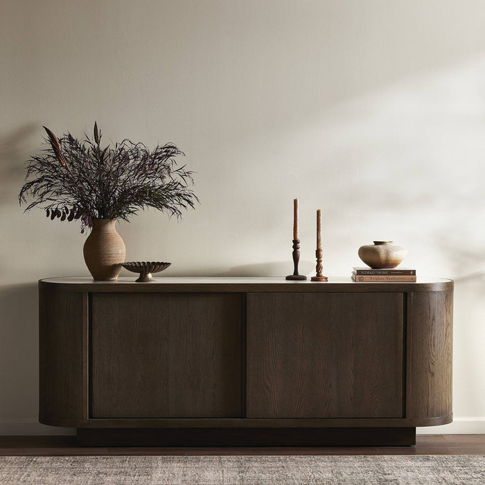 Eleni Sideboard in weathered dark oak featuring a modern curved design and sleek finish.
