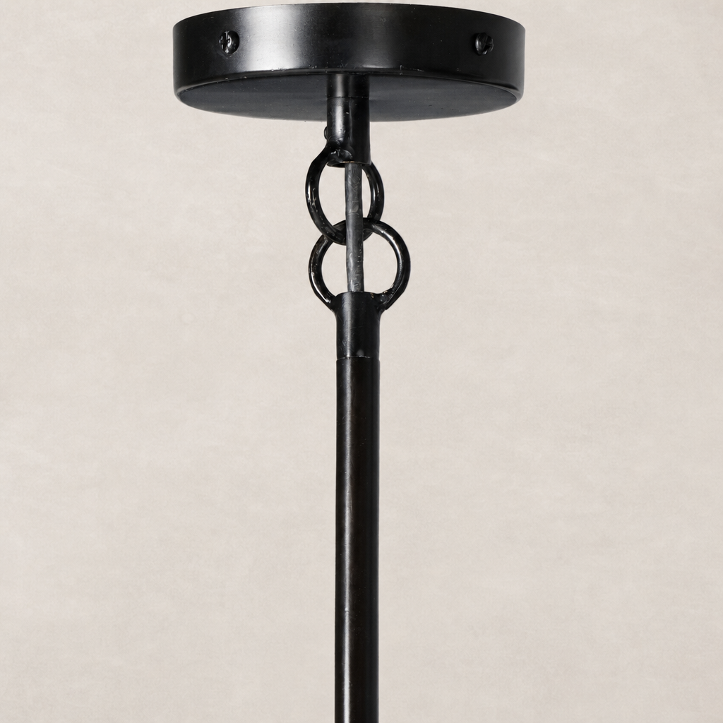 Antique brass iron chandelier with a sleek cylindrical design and decorative chain detail.