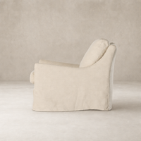 Carmel Slipcover Swivel Chair in Brussels Natural with a sleek, modern design.