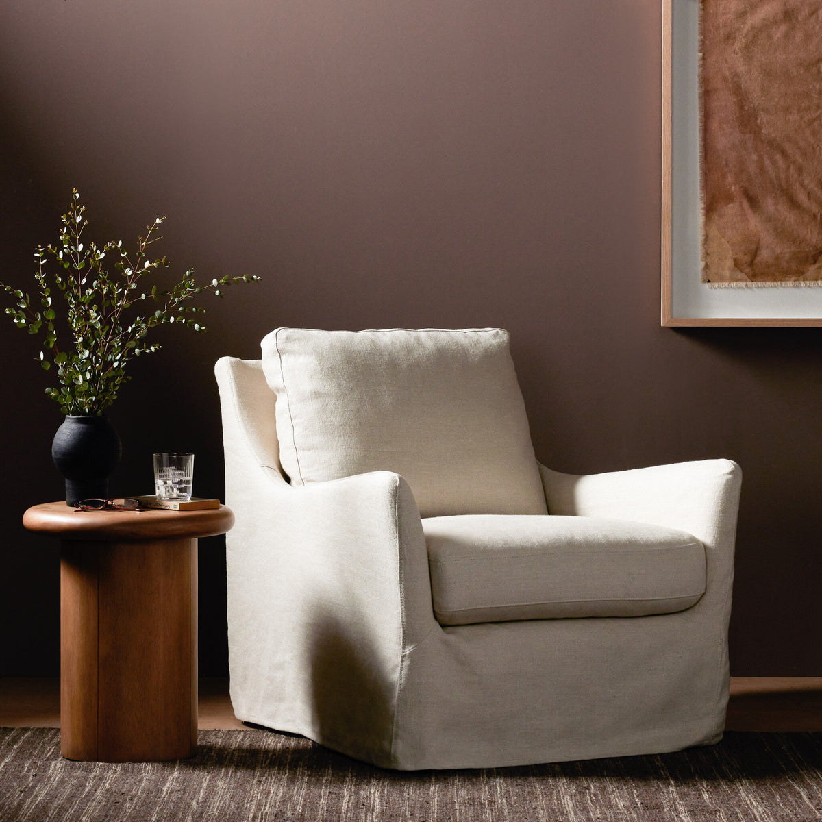 Carmel Slipcover Swivel Chair in Brussels Natural, featuring relaxed lines and plush cushions.
