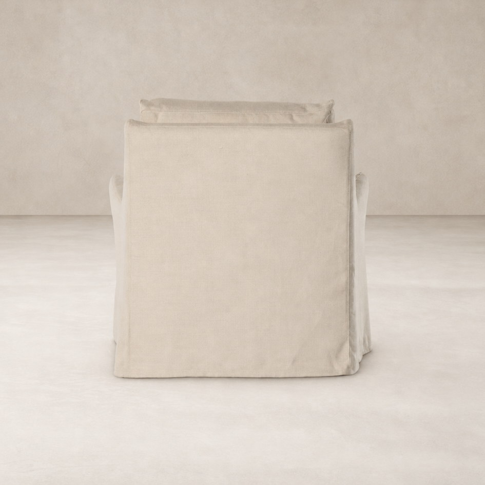 Carmel Slipcover Swivel Chair in Brussels Natural featuring a soft, textured fabric finish.