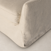 Carmel Slipcover Swivel Chair in Brussels Natural showcasing textured fabric and soft edges.