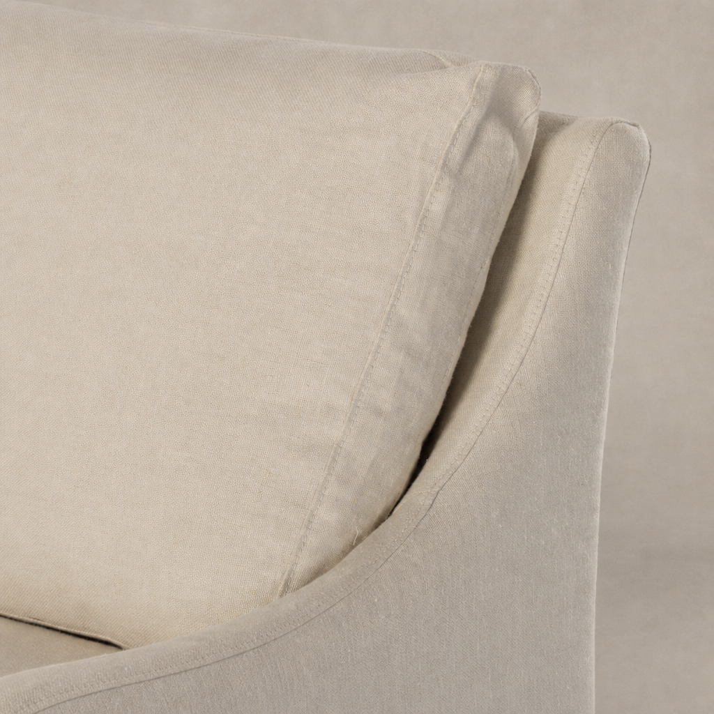 Carmel Slipcover Swivel Chair in Brussels Natural showcasing soft, textured upholstery.