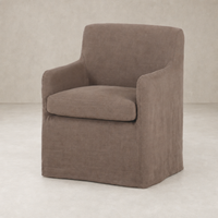 Slipcover dining chair in Brussels Mushroom with plush seat and soft, rounded silhouette.