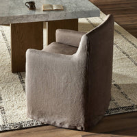 Slipcover dining chair in Brussels Mushroom color with curved back and soft fabric.