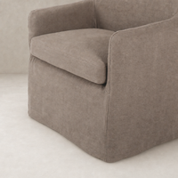 Brussels Mushroom slipcover dining chair with soft cushioning and tailored edges.