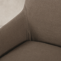 Close-up of Brussels Mushroom slipcover dining chair, showcasing soft fabric texture and curves.