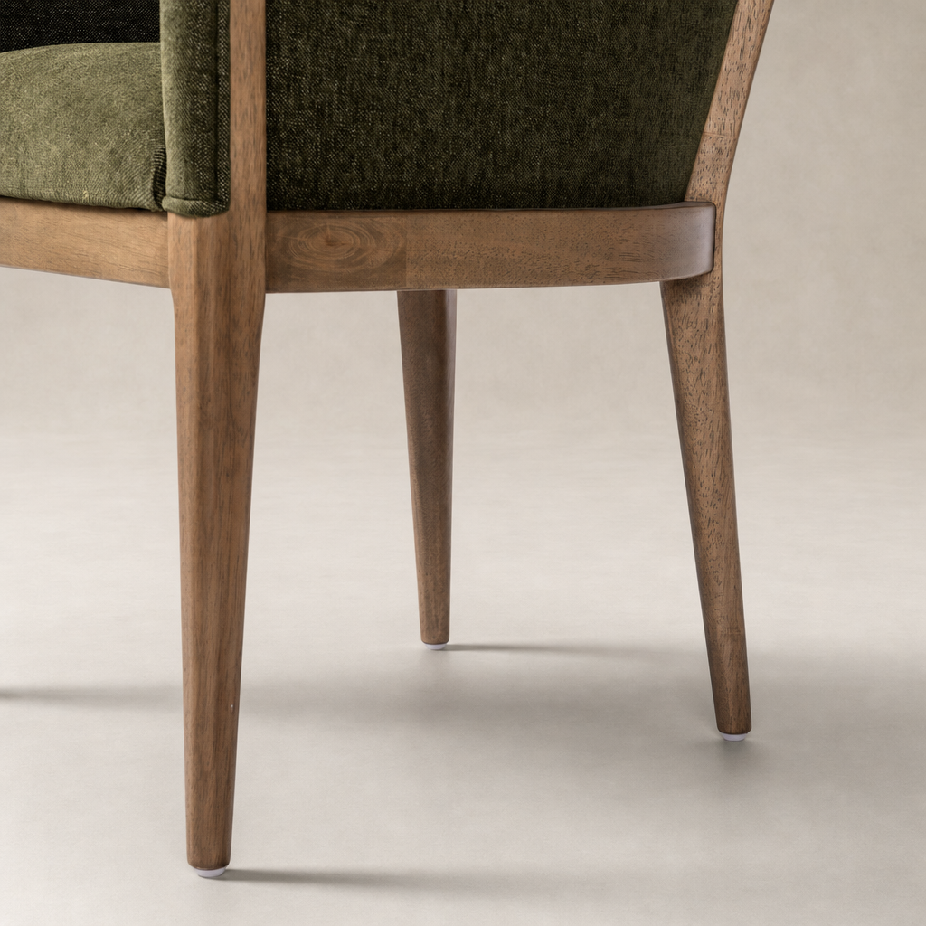 Preston Dining Chair in Sutton Olive with sleek wooden legs and textured upholstery.